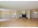 Spacious living room with hardwood floors, fireplace and a view of the kitchen at 6623 Lakeknoll Dr, Indianapolis, IN 46220