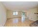 Bright living room featuring hardwood floors, a fireplace, and a sliding glass door at 6623 Lakeknoll Dr, Indianapolis, IN 46220