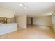 Open-concept living and kitchen area with lots of natural light and hardwood floors at 6623 Lakeknoll Dr, Indianapolis, IN 46220