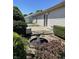 Landscaped back yard with a bird bath feature, greenery and concrete patio at 7259 Registry Dr, Indianapolis, IN 46217