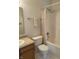 This bathroom has a neutral color palette, shower/tub combo, toilet, sink and vanity area at 7259 Registry Dr, Indianapolis, IN 46217