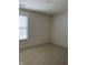 The spacious bedroom with a window offers a relaxing retreat in neutral colors at 7259 Registry Dr, Indianapolis, IN 46217
