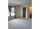 This spacious bedroom has plush carpeting, a large window, and attached bathroom and closet at 7259 Registry Dr, Indianapolis, IN 46217