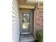 Close up of the home's front door, showcasing the glass screen door and brick and siding at 7259 Registry Dr, Indianapolis, IN 46217