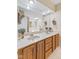 Bathroom with a double vanity, large mirror, and a separate tub and shower area at 7384 Southern Lakes Dr, Indianapolis, IN 46237