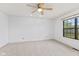 Spacious bedroom features a ceiling fan and a window providing natural light at 7384 Southern Lakes Dr, Indianapolis, IN 46237