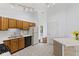 Kitchen boasts wood cabinets, laminate counters, and a breakfast bar at 7384 Southern Lakes Dr, Indianapolis, IN 46237