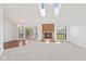 Spacious living room features a fireplace, skylights, large windows and sliding doors to the deck at 7384 Southern Lakes Dr, Indianapolis, IN 46237