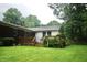 Inviting backyard with wooden deck, green lawn, and privacy fence, perfect for outdoor entertaining and relaxation at 7780 Cree Trl, Indianapolis, IN 46250