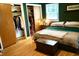 Bedroom with a king bed, closet and wood floors, offers ample storage space and natural light at 7780 Cree Trl, Indianapolis, IN 46250