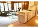 Open concept kitchen and living area featuring white cabinets and countertops, and a breakfast bar at 7780 Cree Trl, Indianapolis, IN 46250