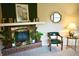 Living room featuring a brick fireplace, plants, and comfortable seating at 7780 Cree Trl, Indianapolis, IN 46250