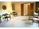 Cozy living area featuring comfortable seating, a table, and a glimpse into another room at 7780 Cree Trl, Indianapolis, IN 46250