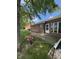 Brick home exterior with a back patio, lush lawn, and colorful flower accents, for outdoor enjoyment at 8092 Crystal Ct, Avon, IN 46123