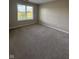 Empty bedroom with a carpet and a window with views of the outdoors and natural light at 8092 Crystal Ct, Avon, IN 46123