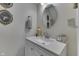 Elegant bathroom with quartz counters, modern fixtures, decorative mirror, and refined design touches at 847 E Jefferson St, Franklin, IN 46131
