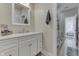 Clean and modern bathroom featuring white cabinets, stone countertops, and updated fixtures at 847 E Jefferson St, Franklin, IN 46131