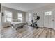 Well-lit bedroom featuring a comfortable bed, exercise bike, and bright natural light at 847 E Jefferson St, Franklin, IN 46131