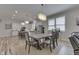 Elegant dining area with stylish lighting, seamlessly connected to the open kitchen space at 847 E Jefferson St, Franklin, IN 46131