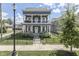 Charming two-story home with a double-decker porch, fenced yard, and manicured landscaping at 847 E Jefferson St, Franklin, IN 46131