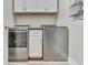 Functional laundry room with modern washer and dryer, white cabinets, and efficient layout for convenience at 847 E Jefferson St, Franklin, IN 46131