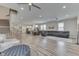 Open-concept living area with hardwood floors, seamlessly connecting living, dining, and kitchen spaces at 847 E Jefferson St, Franklin, IN 46131