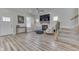 Spacious living room featuring hardwood floors, fireplace, and plenty of natural light at 847 E Jefferson St, Franklin, IN 46131