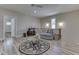 Bright living room featuring a comfortable lounge area and a stylish glass-topped coffee table at 847 E Jefferson St, Franklin, IN 46131