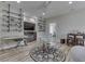 Spacious living room featuring custom shelving, entertainment center, and a unique glass coffee table at 847 E Jefferson St, Franklin, IN 46131
