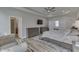 Main bedroom showcases tray ceiling, wood floors, and elegant furniture for a relaxing and comfortable space at 847 E Jefferson St, Franklin, IN 46131
