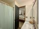 Bathroom leading into bedroom; includes updated vanity, marble countertop, and fixtures at 8829 Tracy Dr, Clayton, IN 46118