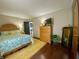 Bedroom featuring wood floors, area rug, and natural wood furniture at 8829 Tracy Dr, Clayton, IN 46118