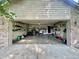 Spacious two-car garage with ample shelving, providing storage solutions for tools and equipment at 8829 Tracy Dr, Clayton, IN 46118