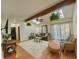 Bright living room with hardwood floors, skylight, and a cozy seating arrangement at 8829 Tracy Dr, Clayton, IN 46118
