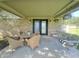 Covered patio with seating area perfect for outdoor entertaining at 8829 Tracy Dr, Clayton, IN 46118