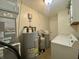 Utility room with water heater, HVAC unit, and storage space at 8829 Tracy Dr, Clayton, IN 46118