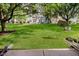 View of a well-kept lawn and shared backyard space between homes with mature trees at 9689 Exchange St, Fishers, IN 46038