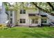 Well-maintained backyard with lush lawn, air conditioning unit, and the rear exterior of the home at 9689 Exchange St, Fishers, IN 46038