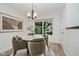 Bright dining area with a round table, seating for four, and a view of the outdoors at 9689 Exchange St, Fishers, IN 46038