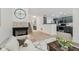Inviting living room with a fireplace and stairs that lead to the upper level at 9689 Exchange St, Fishers, IN 46038