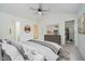 Bright main bedroom featuring neutral walls, carpet floors, and a walk-in closet at 9689 Exchange St, Fishers, IN 46038