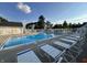 Enjoy this community pool with plentiful seating and clear blue water on a sunny day at 9689 Exchange St, Fishers, IN 46038