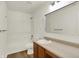The bathroom has a large mirror above a single sink and a shower and bathtub combo at 10658 Pavilion Dr, Indianapolis, IN 46259