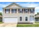 Charming two-story home with red shutters, large garage, and well-maintained lawn at 10658 Pavilion Dr, Indianapolis, IN 46259