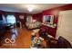 Cozy bedroom featuring hardwood floors, a decorative mirror, and ample natural light at 10720 Lakeview Dr, Carmel, IN 46033