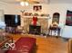Inviting living room with stone fireplace, hardwood floors, and ample seating at 10720 Lakeview Dr, Carmel, IN 46033