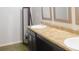 Bright bathroom with modern vanity, mirror, and wood-look floors at 11445 Congaree Way, Indianapolis, IN 46235