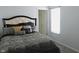Bedroom showcasing a bed with decorative pillows and a sunlit window at 11445 Congaree Way, Indianapolis, IN 46235
