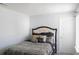 Bedroom featuring a bed with decorative pillows and a door at 11445 Congaree Way, Indianapolis, IN 46235