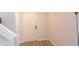 Bright entryway with light wood floors, white walls, and a white front door at 11445 Congaree Way, Indianapolis, IN 46235